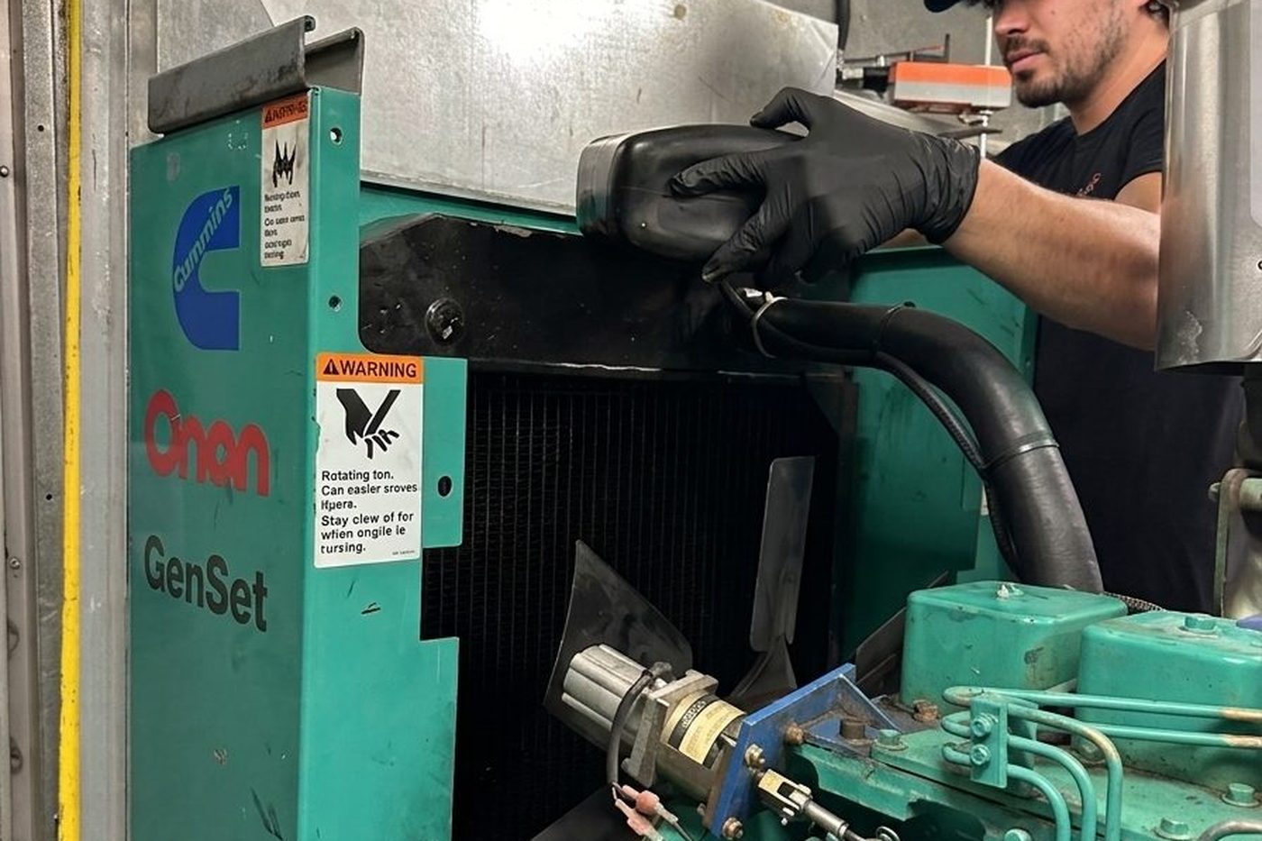 Cummins Onan standby genset being serviced by a GenWorx technician